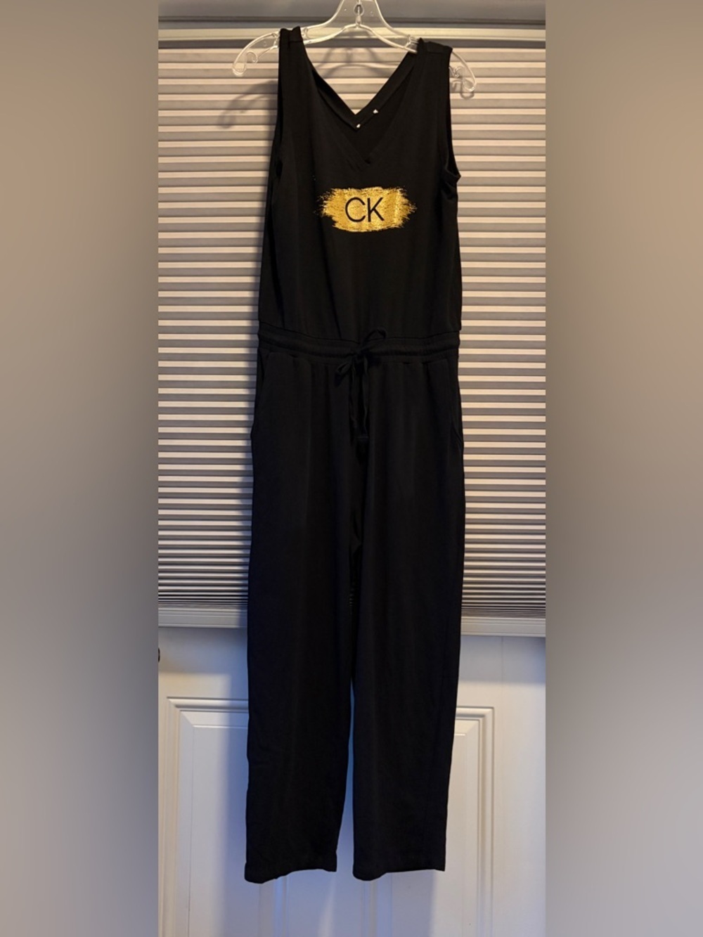 Calvin Klein Black Sleeveless Drawstring-Waist Jumpsuit with Gold Logo